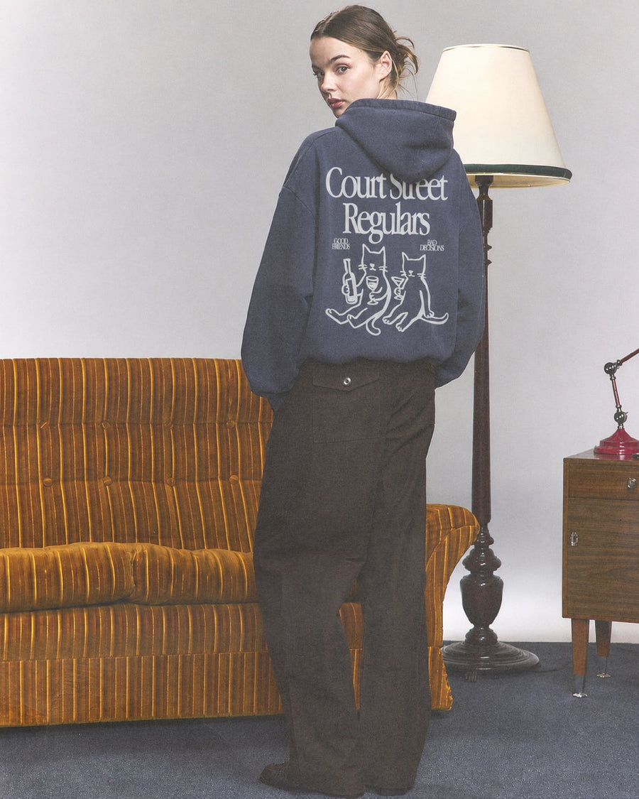 Court Street Regulars Faded Blue Hoodie — model floor shot